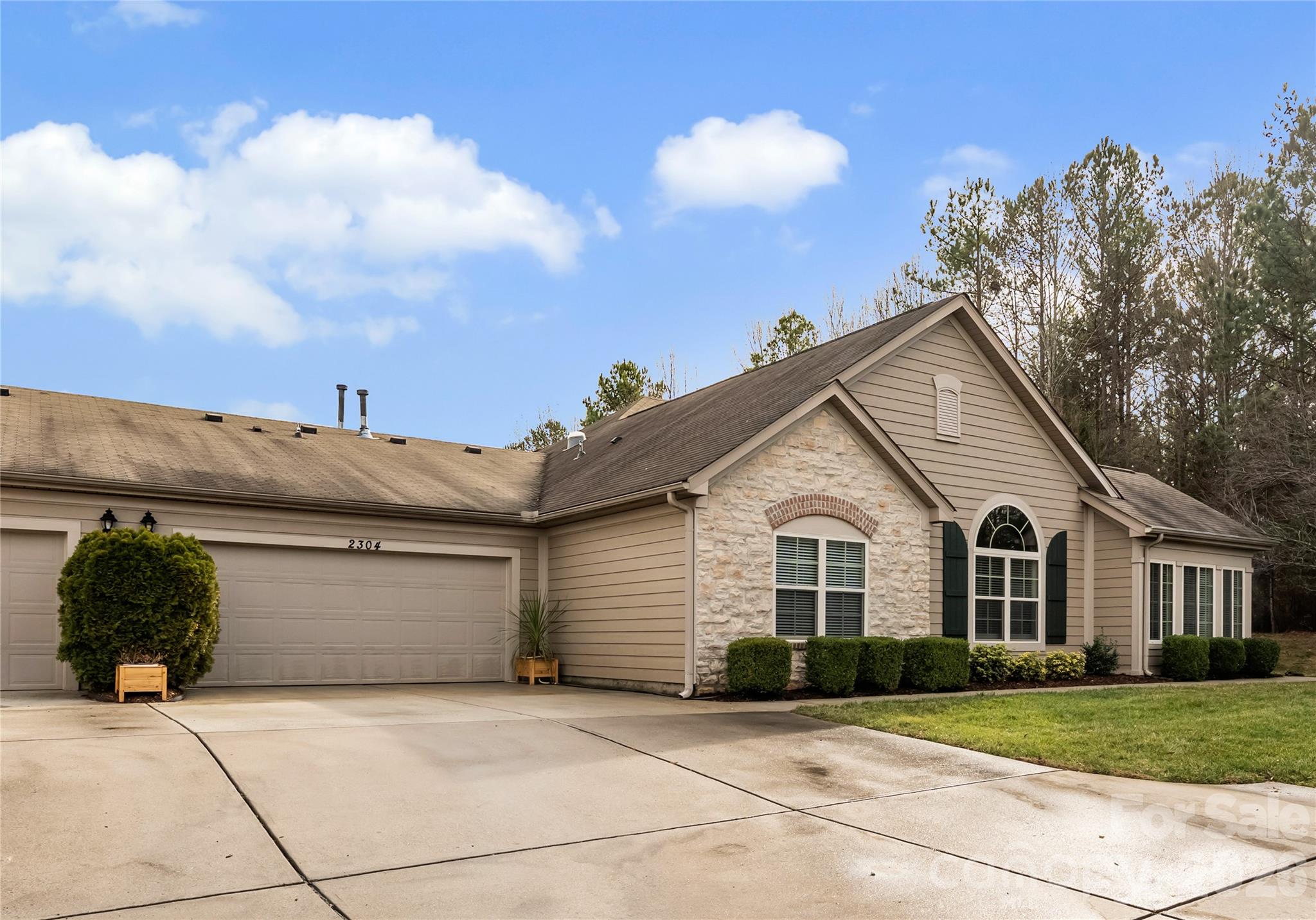 2304 Coltsview Lane Matthews, NC 28105 - Photo 24 of 36 a view of a house with a yard