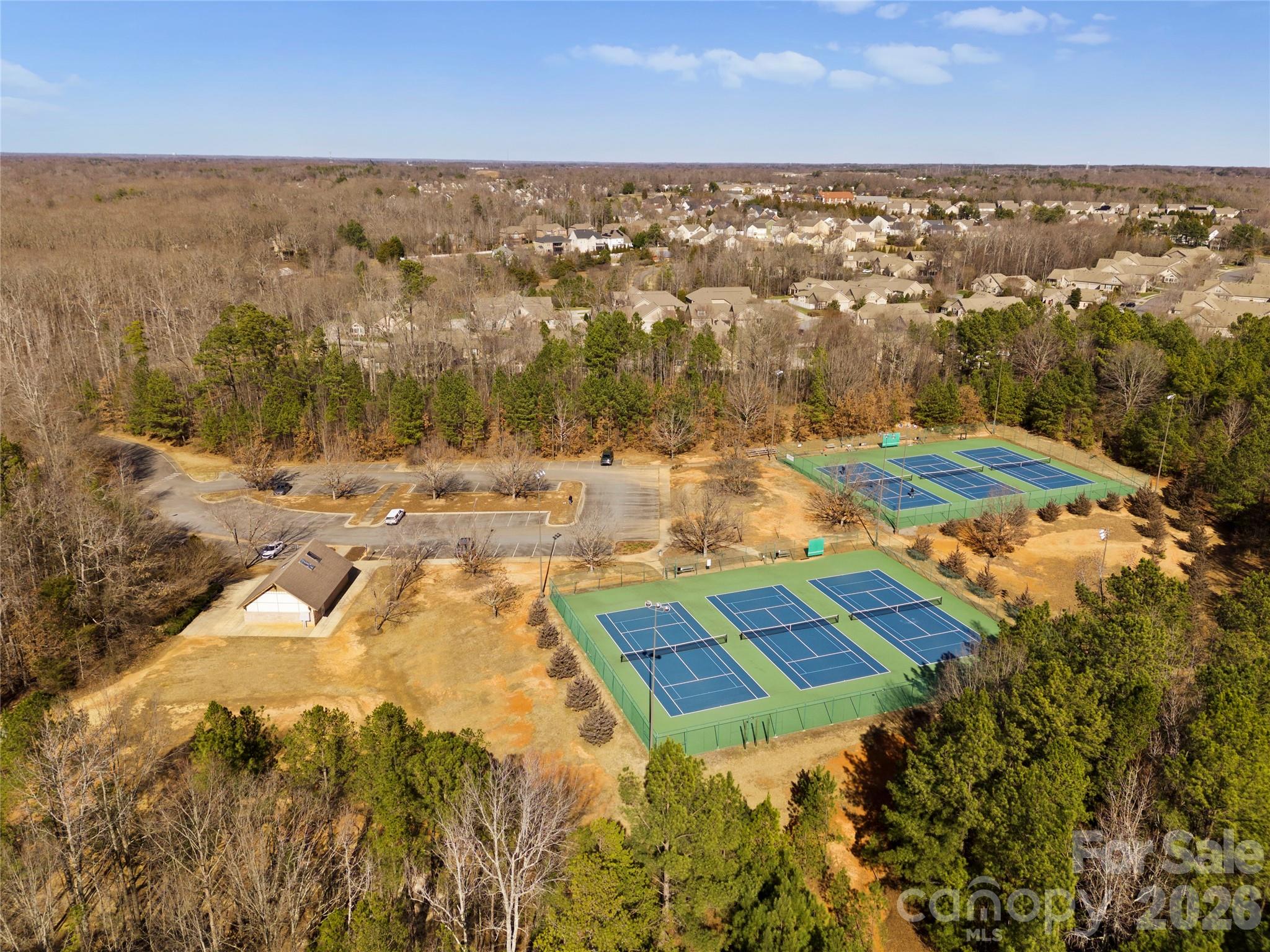 2304 Coltsview Lane Matthews, NC 28105 - Photo 32 of 36 an aerial view of residential houses with outdoor space