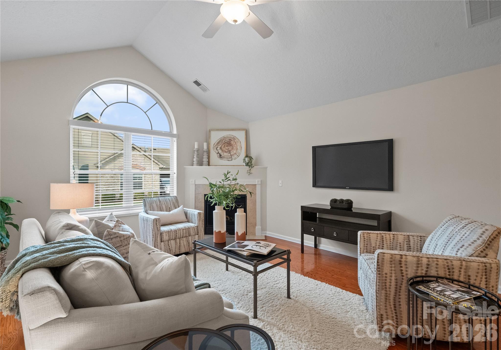 2304 Coltsview Lane Matthews, NC 28105 - Photo 6 of 36 a living room with furniture a flat screen tv and a window