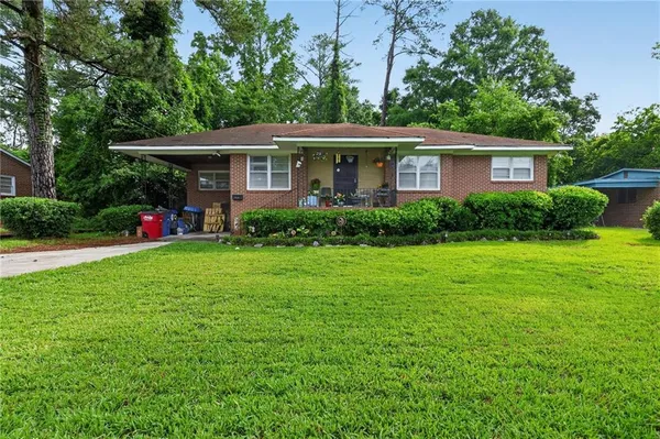 a view of house with yard