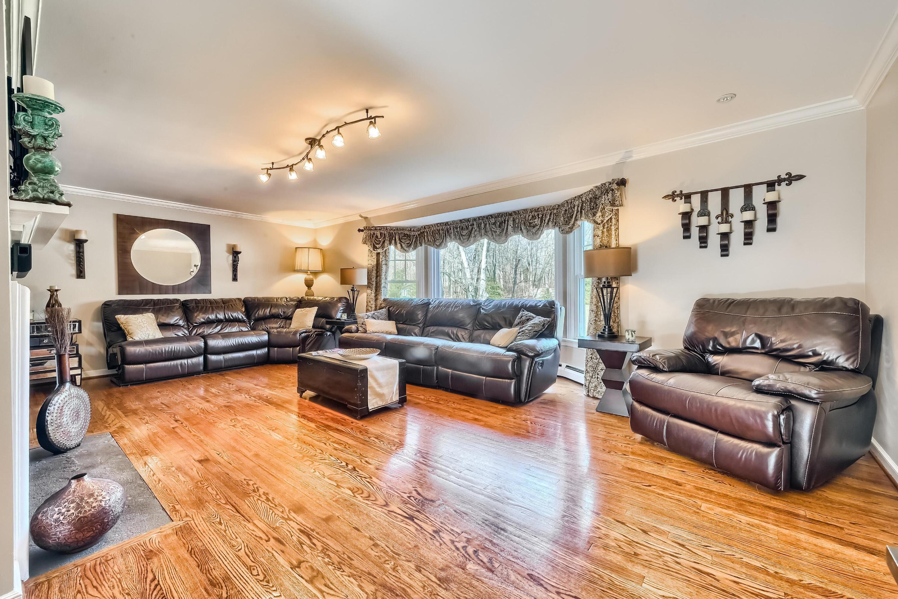 62 Beech Road New Canaan, CT 06840 - Photo 8 of 40 a living room with furniture and a wooden floor