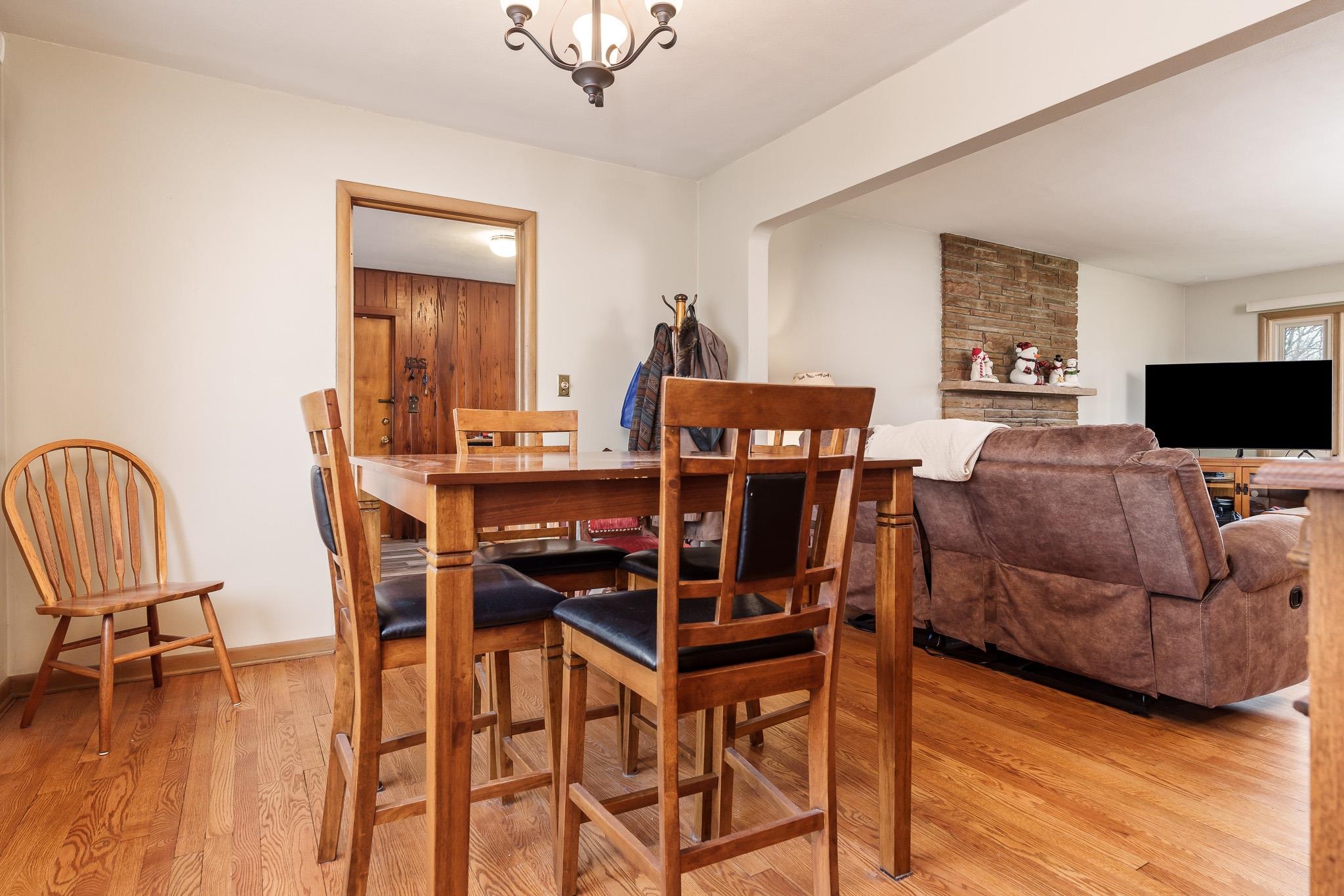 3704 Highcrest Road Rockford, IL 61107 - Photo 11 of 33 a living room with furniture and a flat screen tv