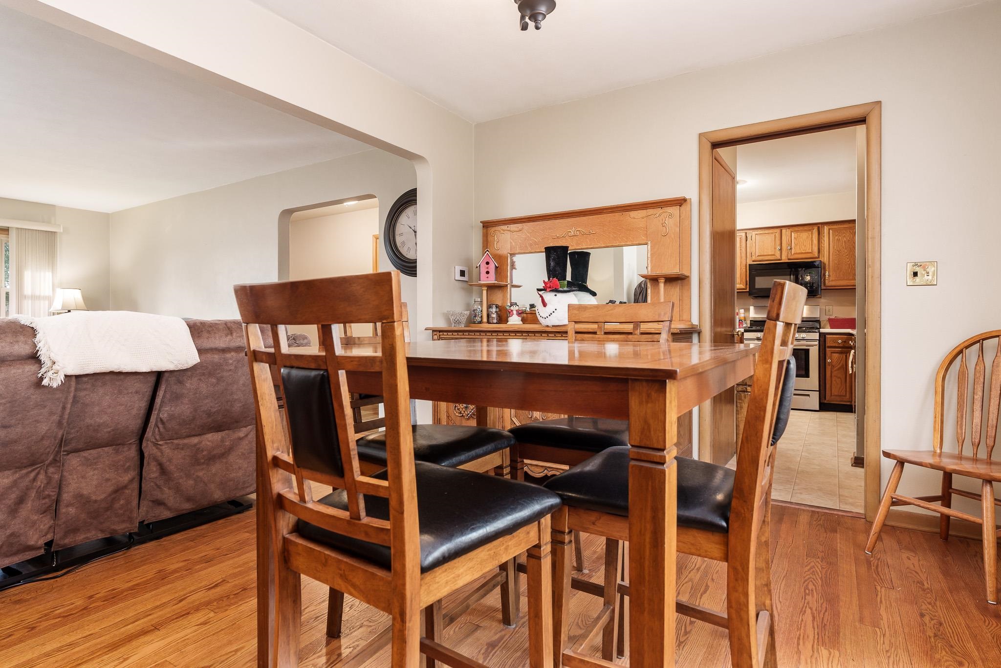 3704 Highcrest Road Rockford, IL 61107 - Photo 12 of 33 a view of a dining room with furniture and wooden floor