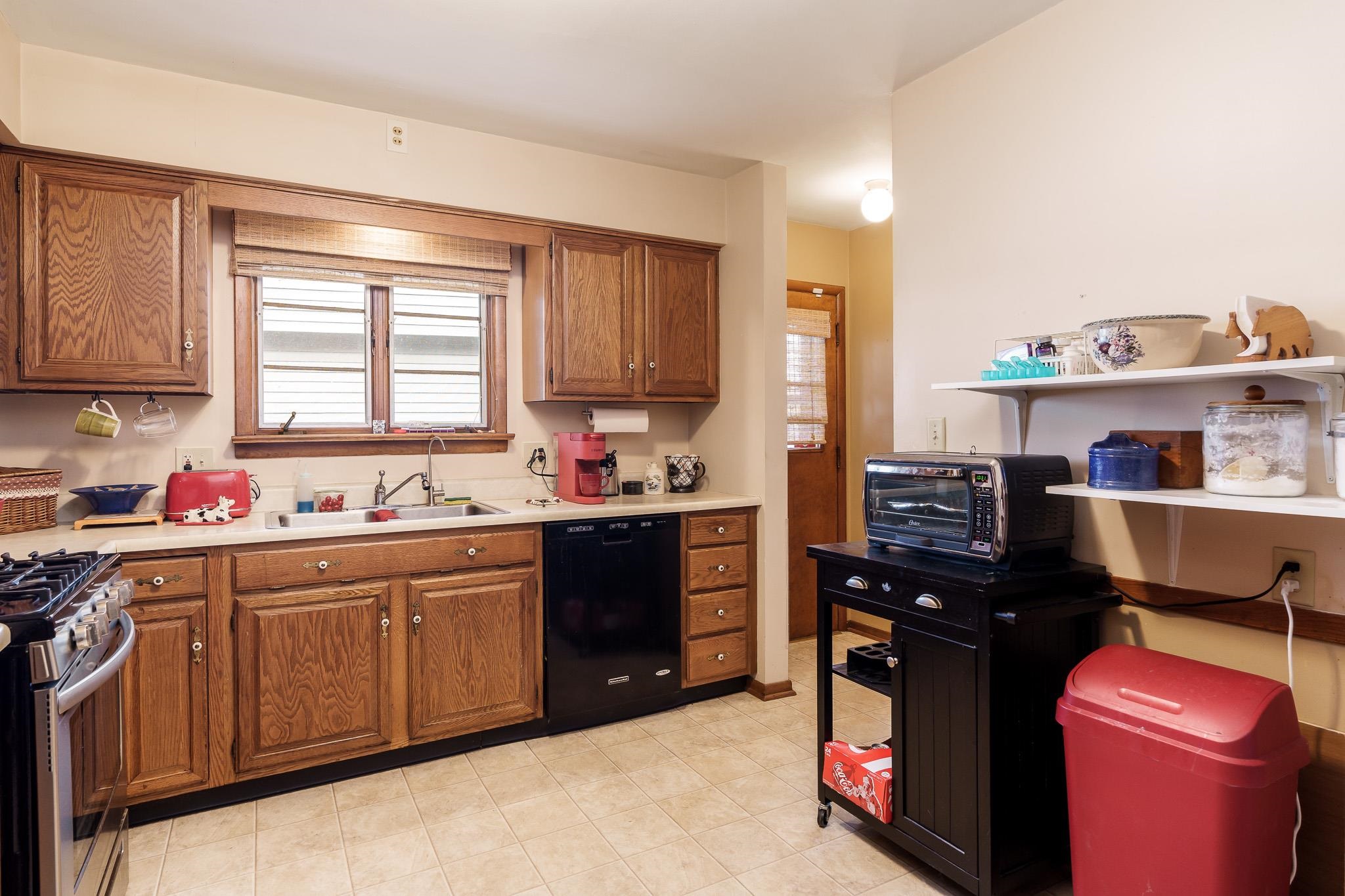 3704 Highcrest Road Rockford, IL 61107 - Photo 15 of 33 a kitchen with a refrigerator stove and sink