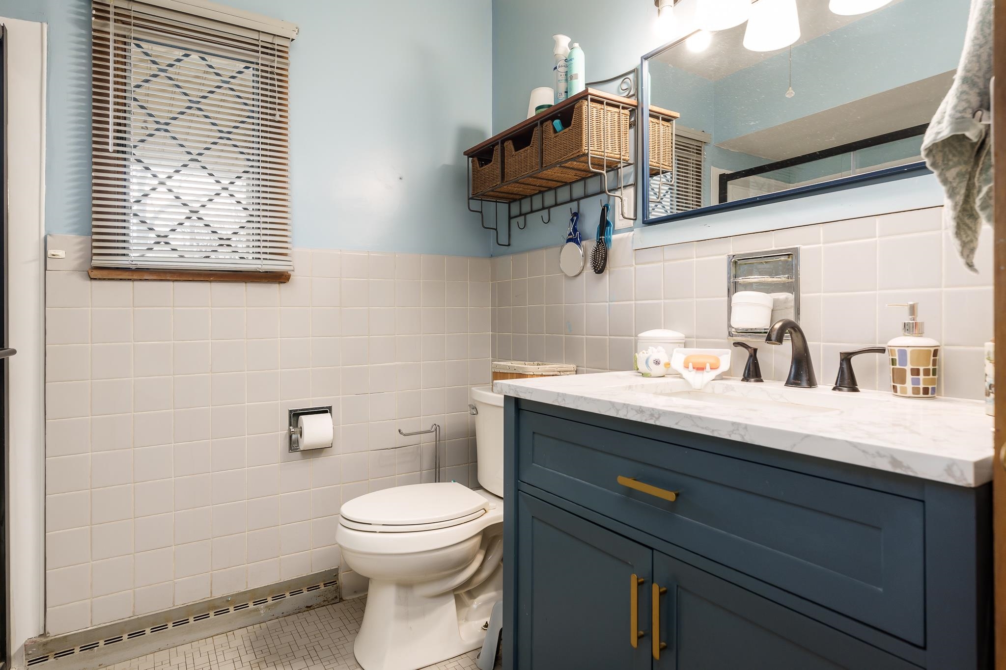 3704 Highcrest Road Rockford, IL 61107 - Photo 17 of 33 a bathroom with a granite countertop sink a toilet and a mirror