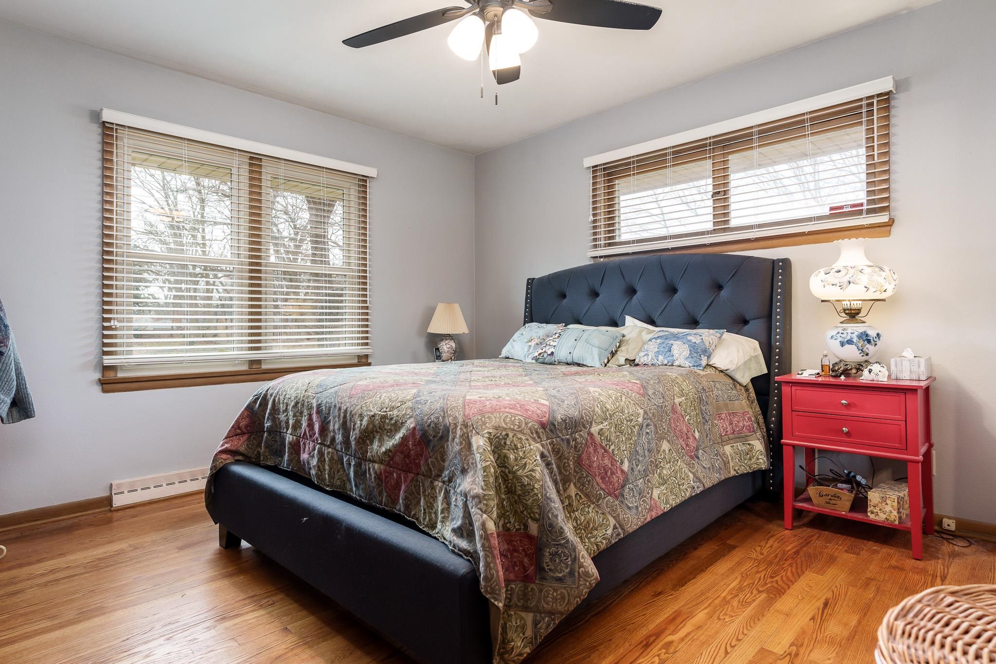 3704 Highcrest Road Rockford, IL 61107 - Photo 19 of 33 a bedroom with a bed and a chandelier