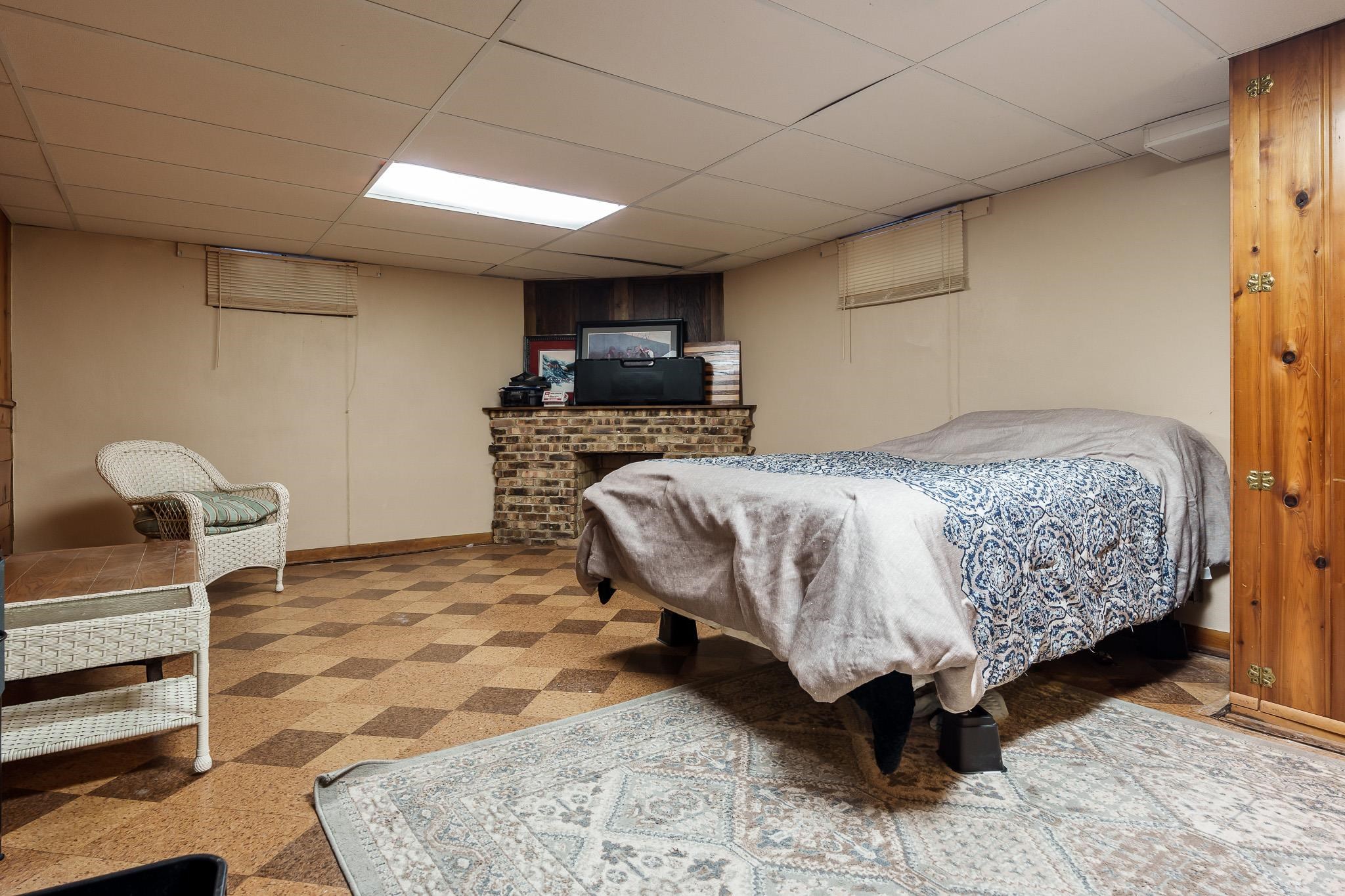 3704 Highcrest Road Rockford, IL 61107 - Photo 26 of 33 a bedroom with a bed and a television