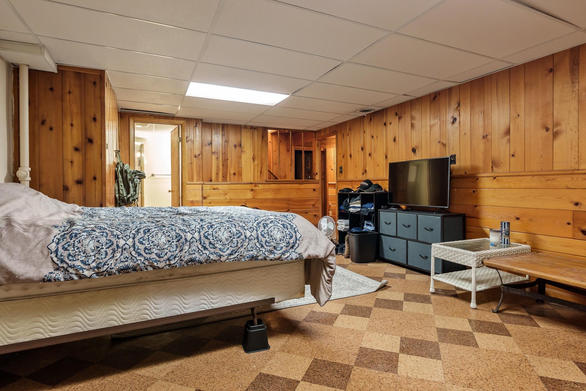 3704 Highcrest Road Rockford, IL 61107 - Photo 27 of 33 a bedroom with a bed and wooden floor