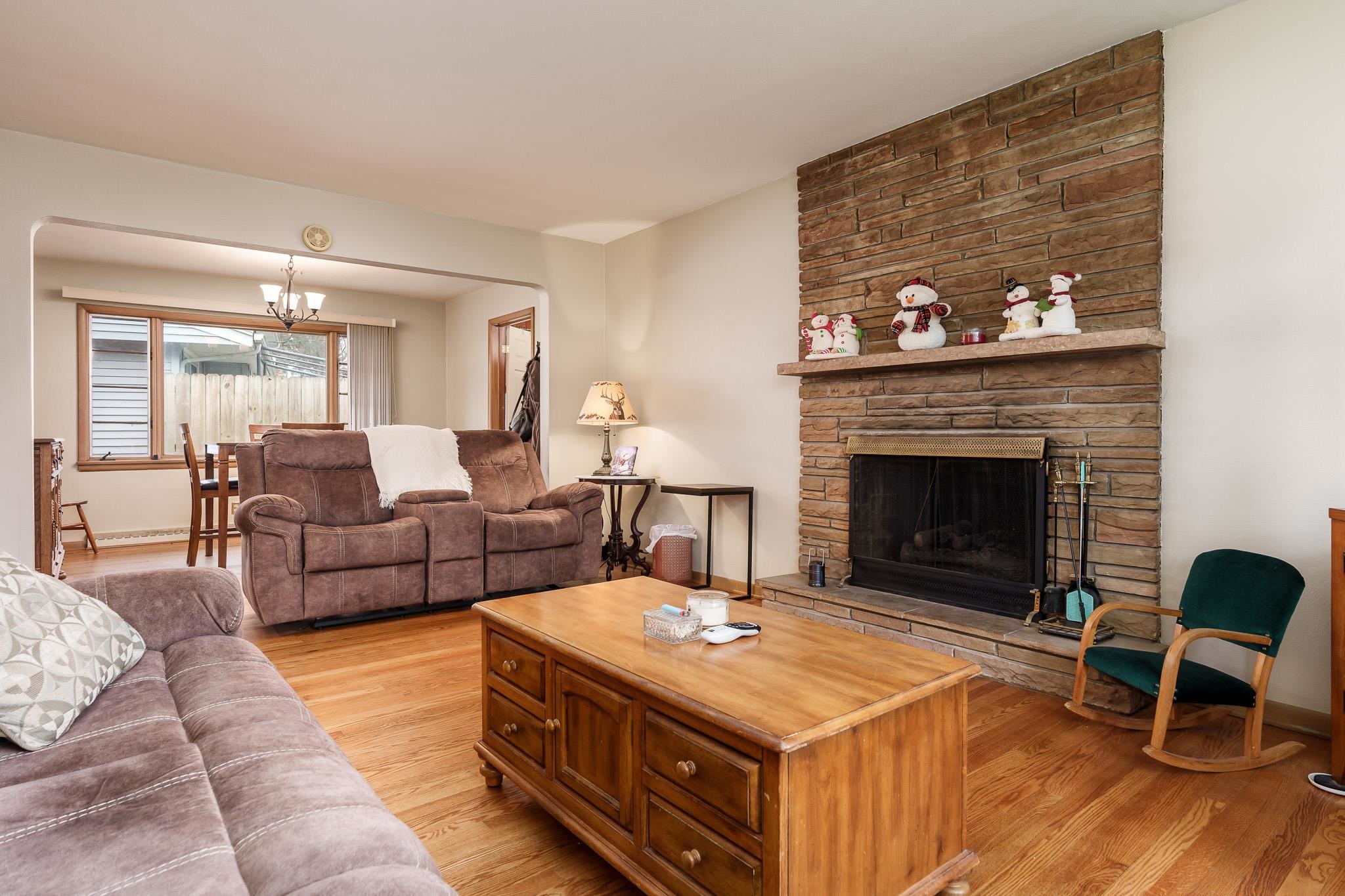3704 Highcrest Road Rockford, IL 61107 - Photo 9 of 33 a living room with furniture and a fireplace