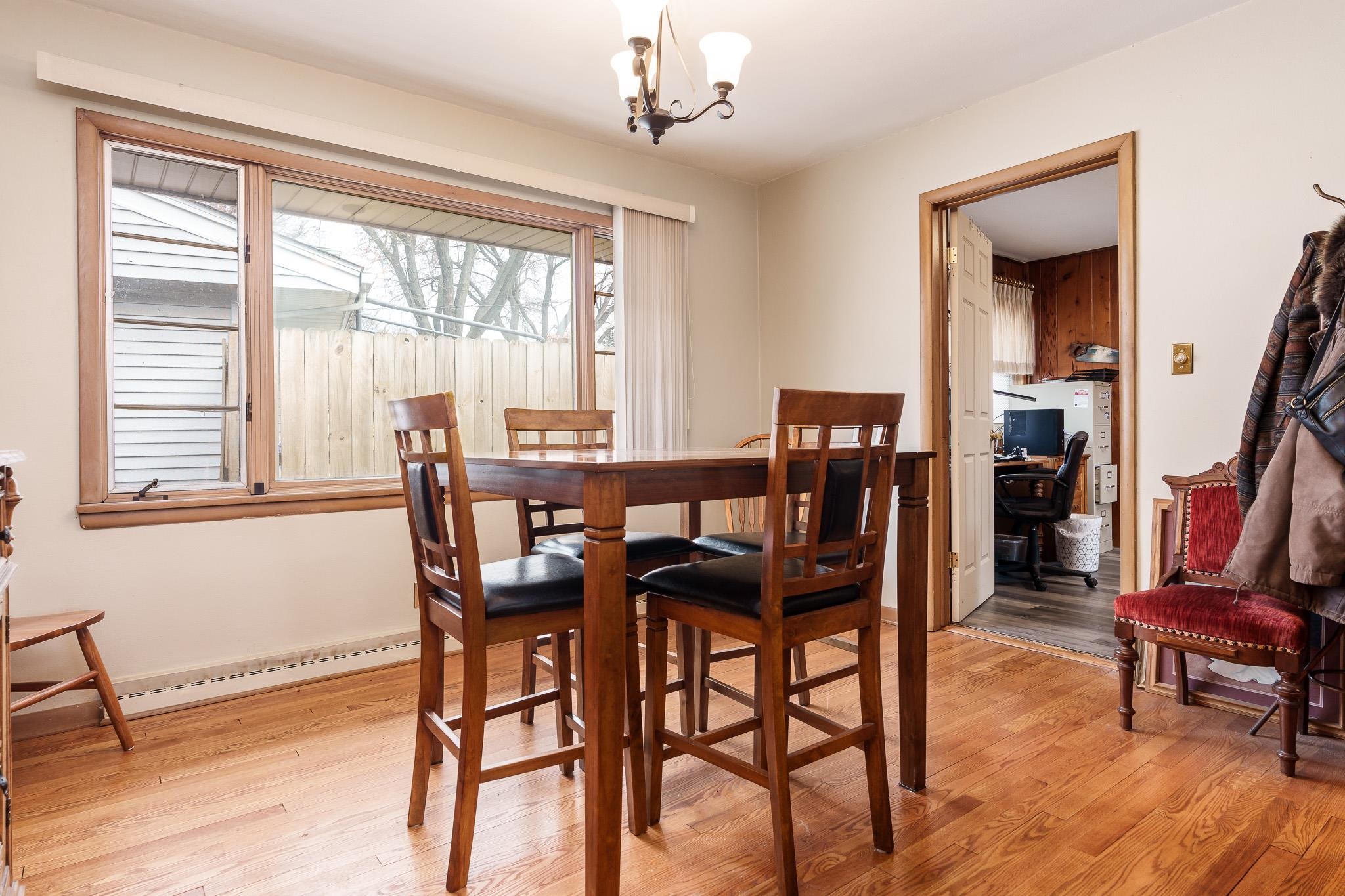 3704 Highcrest Road Rockford, IL 61107 - Photo 10 of 33 a view of a dining room with furniture window and wooden floor