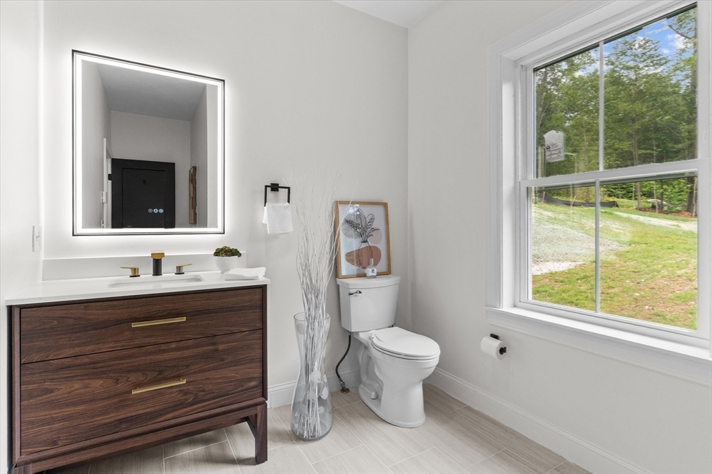 508 Pine Street Leicester, MA 01524 - Photo 11 of 34 a bathroom with a toilet sink and mirror