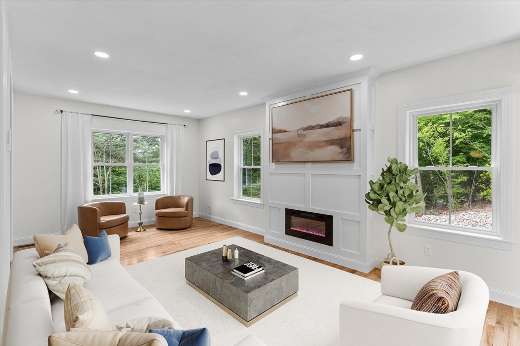 508 Pine Street Leicester, MA 01524 - Photo 12 of 34 a living room with furniture a fireplace and a potted plant
