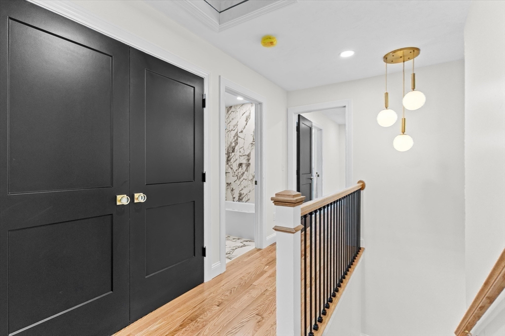508 Pine Street Leicester, MA 01524 - Photo 16 of 34 a view of a hallway with wooden floor and staircase