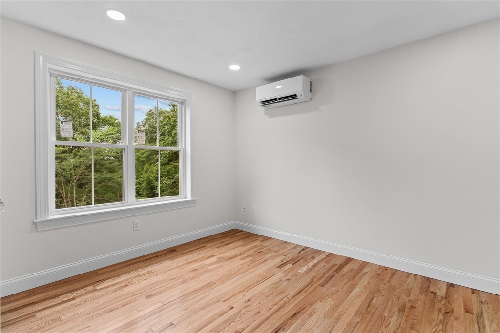508 Pine Street Leicester, MA 01524 - Photo 18 of 34 an empty room with wooden floor and windows