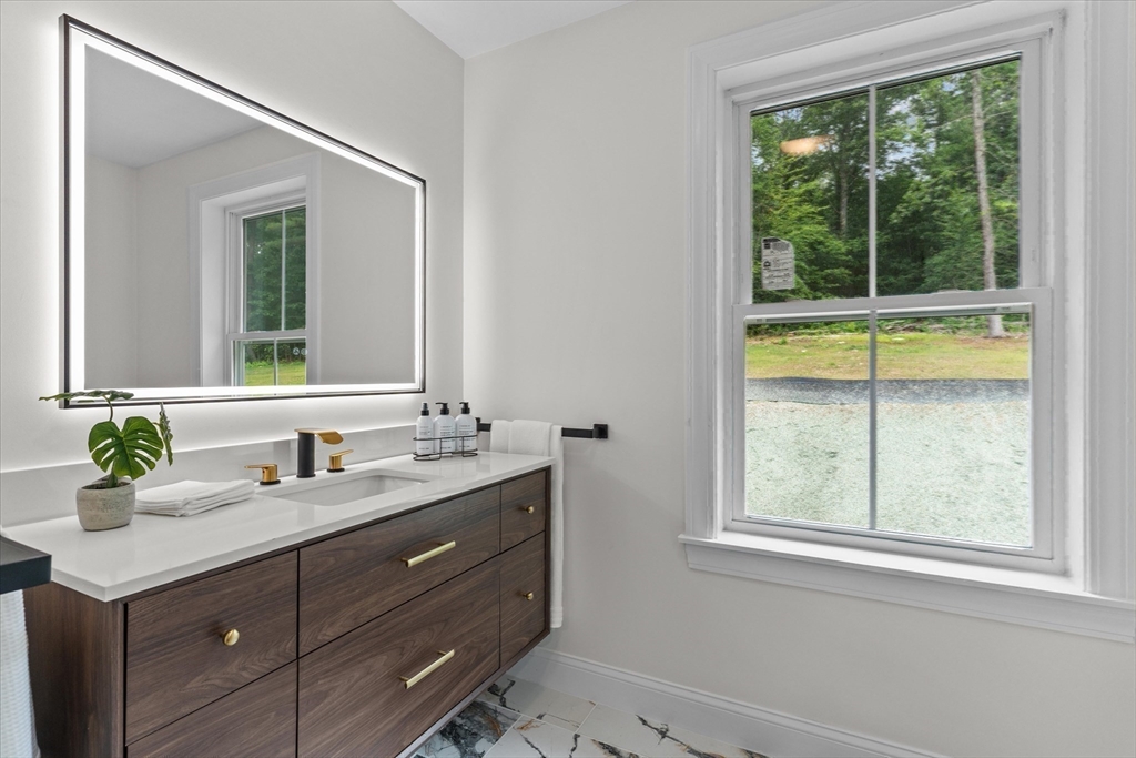 508 Pine Street Leicester, MA 01524 - Photo 21 of 34 a bathroom with a sink and a mirror