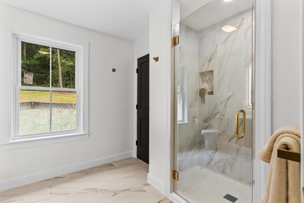 508 Pine Street Leicester, MA 01524 - Photo 26 of 34 a bathroom with a bathtub and a shower