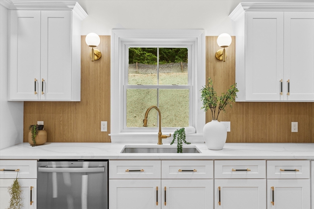 508 Pine Street Leicester, MA 01524 - Photo 3 of 34 a kitchen with cabinets a potted plant and a window