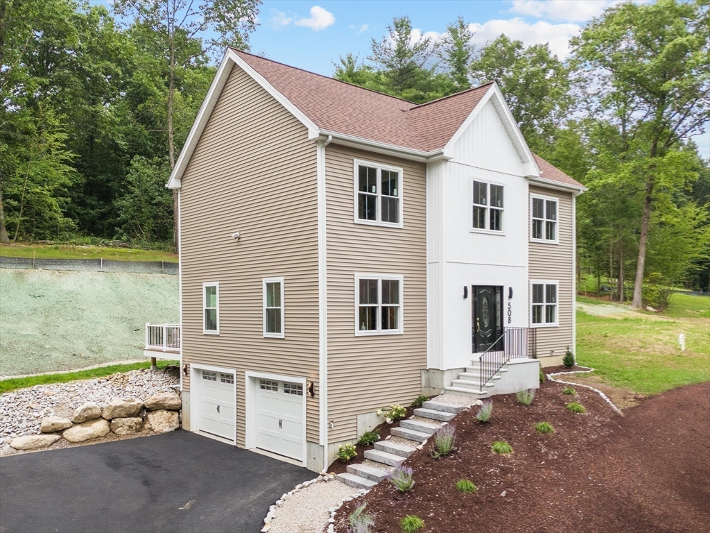 508 Pine Street Leicester, MA 01524 - Photo 32 of 34 a view of a yard in front of a house with a large tree