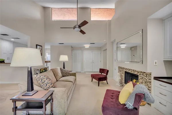 a view of a dining room with furniture and a chandelier