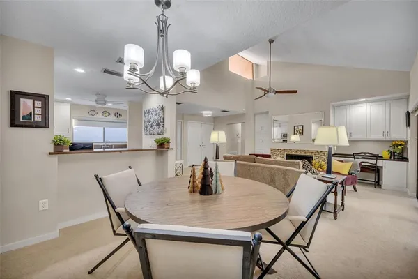 a kitchen with kitchen island and stainless steel appliances