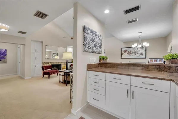 a view of a kitchen with cabinets