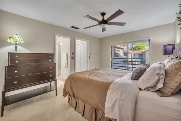 a bathroom with a sink toilet double vanity and tub