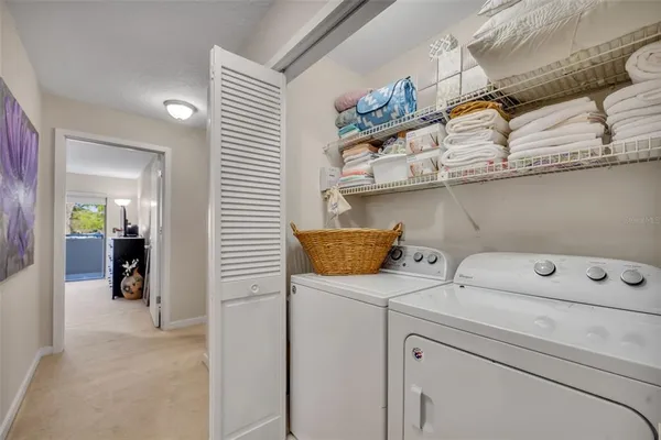 a view of an empty room with a fireplace