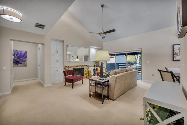 a living room with furniture and a fireplace