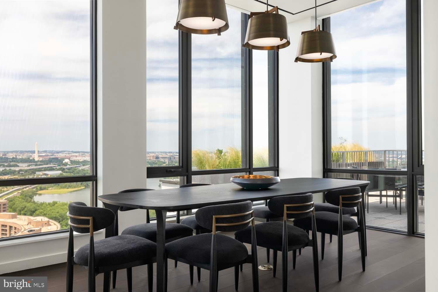 269 19th Court South, Unit PH2302 Arlington, VA 22202 - Photo 16 of 28 a view of a dining room with furniture window and outside view