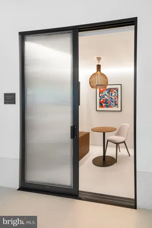 a kitchen with a table and chairs in it