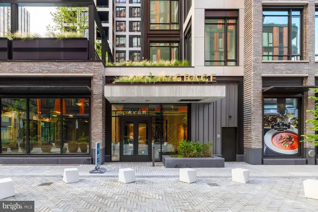 a lobby with furniture and floor to ceiling window