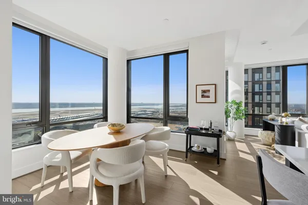 a hallway with a fireplace and a wooden floor