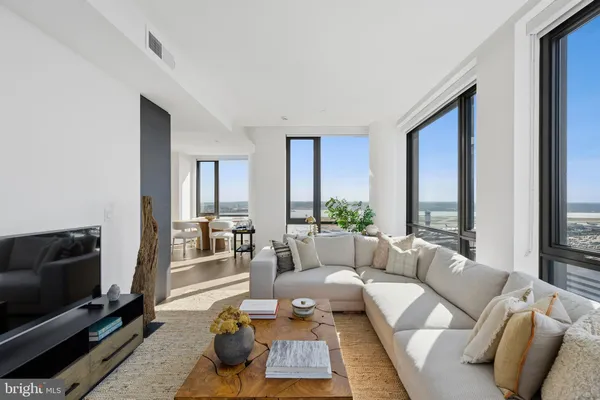 a lobby with furniture and a potted plant