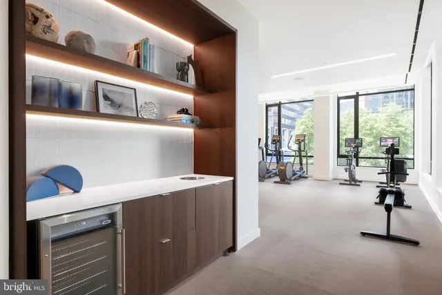 a room with gym equipment and a large window