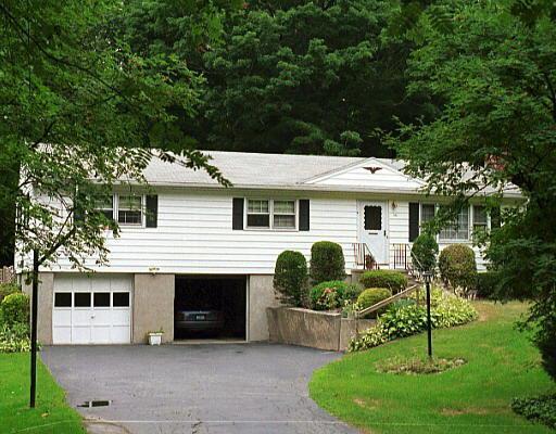 661 Booth Hill Road Shelton, CT 06484 - Photo 1 of 1 a view of house with a yard and potted plants
