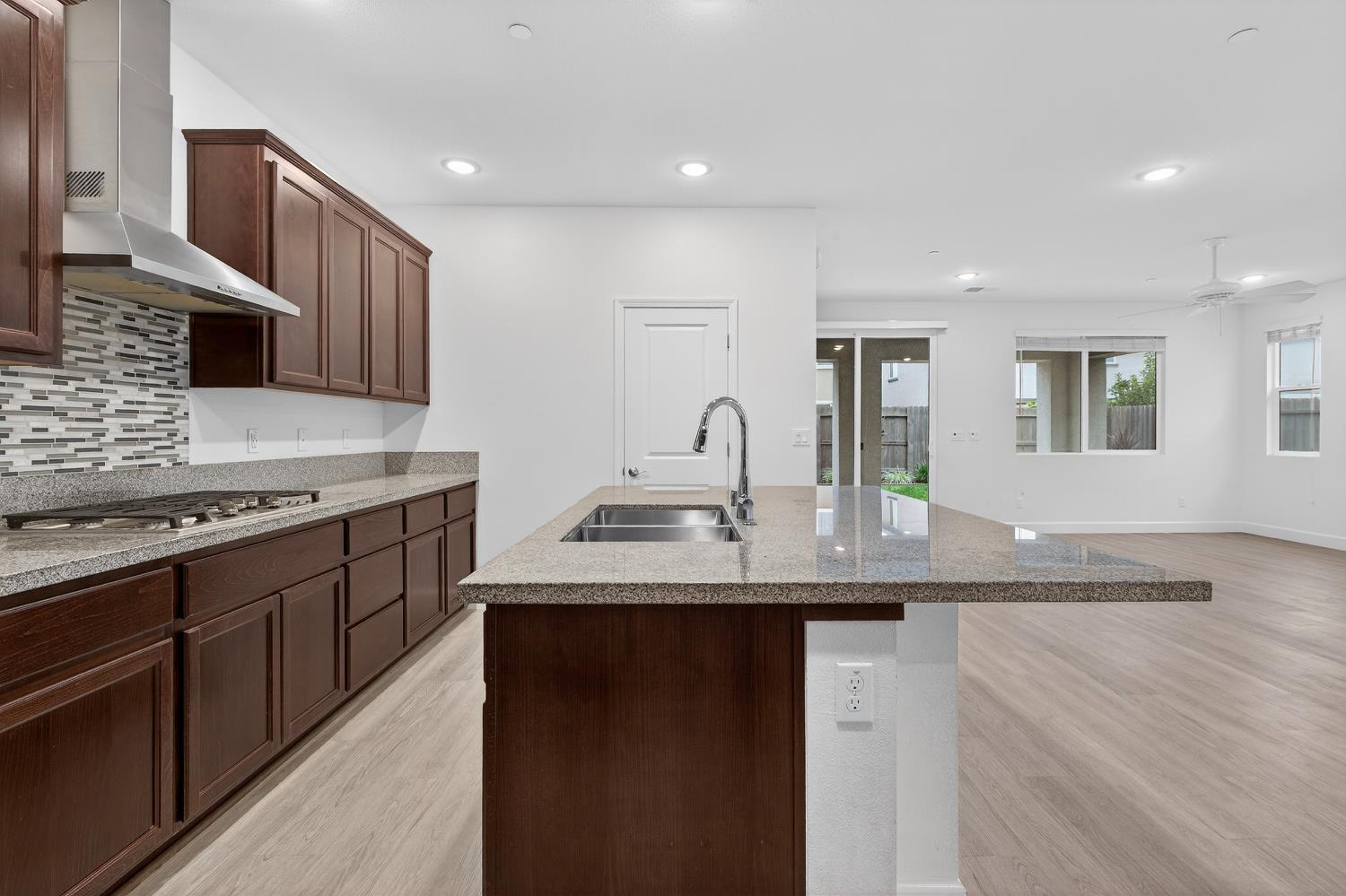 2340 Bellows Way Lodi, CA 95242 - Photo 18 of 42 a kitchen with stainless steel appliances granite countertop a sink stove and cabinets