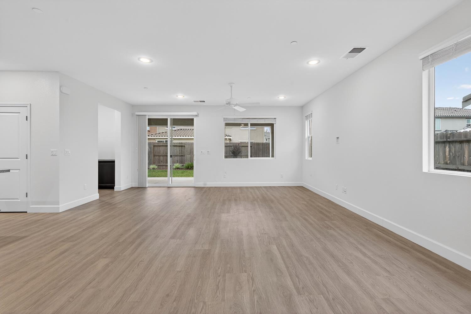 2340 Bellows Way Lodi, CA 95242 - Photo 21 of 42 an empty room with wooden floor and windows