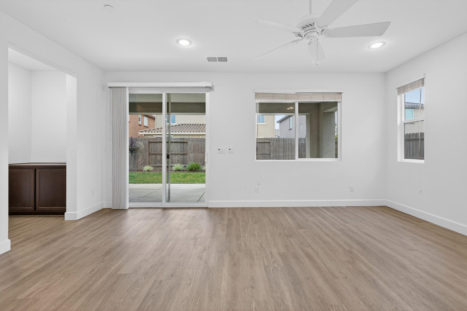 2340 Bellows Way Lodi, CA 95242 - Photo 23 of 42 a view of an empty room with wooden floor and a window