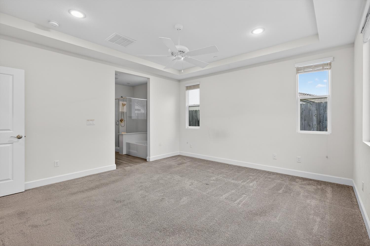 2340 Bellows Way Lodi, CA 95242 - Photo 26 of 42 an empty room with windows and closet