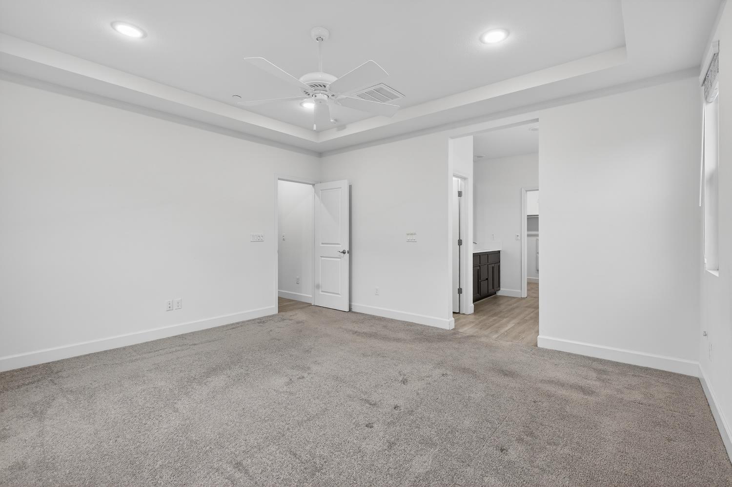 2340 Bellows Way Lodi, CA 95242 - Photo 27 of 42 an empty room with a ceiling fan and bathroom