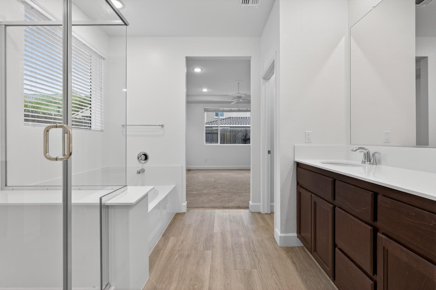 2340 Bellows Way Lodi, CA 95242 - Photo 31 of 42 a bathroom with a sink a large mirror and shower