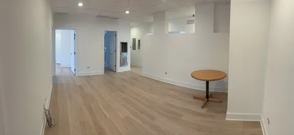 a view of a hallway with a room