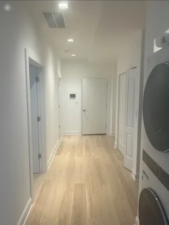 a view of empty room with washer and dryer