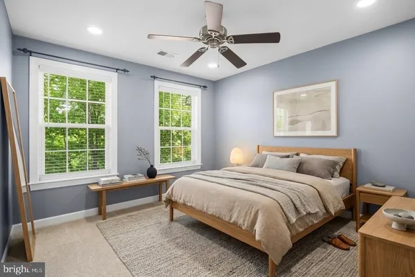 a bedroom with a bed and window