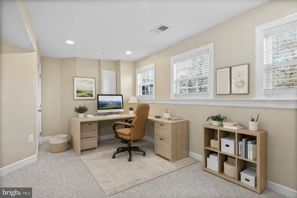 a workspace with furniture and window