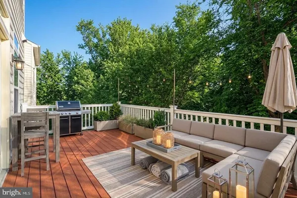 a view of a chairs and tables on the roof deck