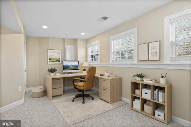 a workspace with furniture and window