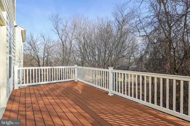 a view of deck with wooden floor and fence