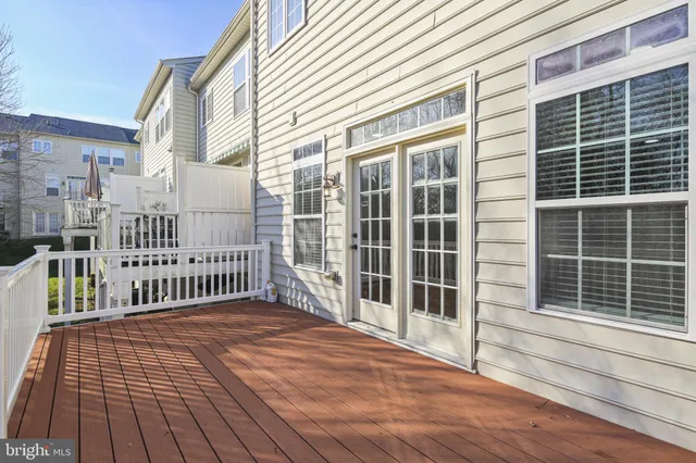 a view of a balcony with a barbeque