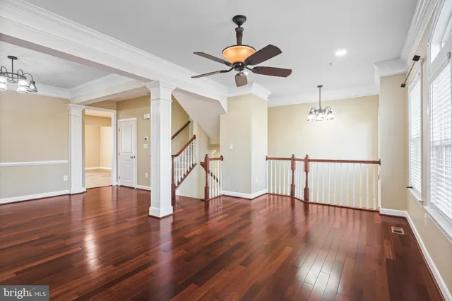 a view of an entryway with wooden floor and a window